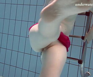Underwater swimming teenie Lenka gets bare