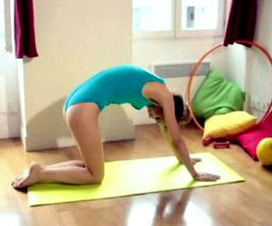 Teenage gymnast chick practising yoga in bathing suit at